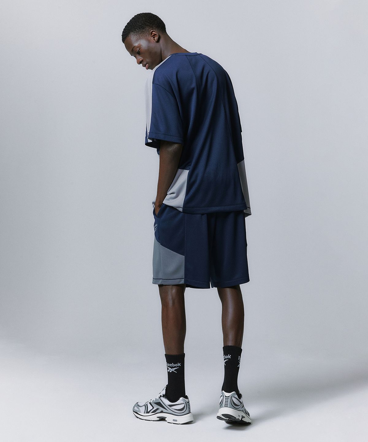 리복(REEBOK) 패널드 벡터 메쉬 쇼츠 - 네이비