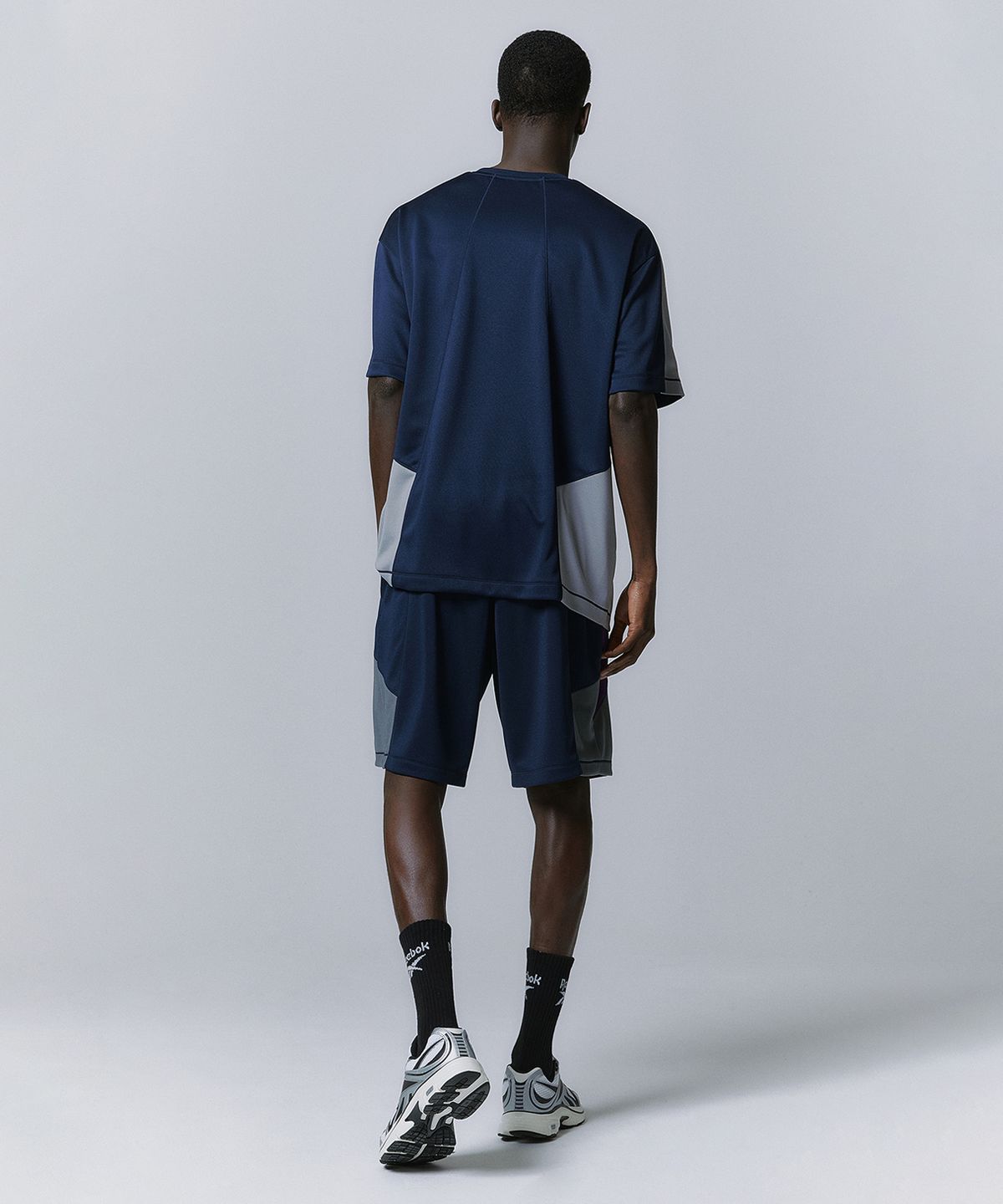 리복(REEBOK) 패널드 벡터 메쉬 쇼츠 - 네이비
