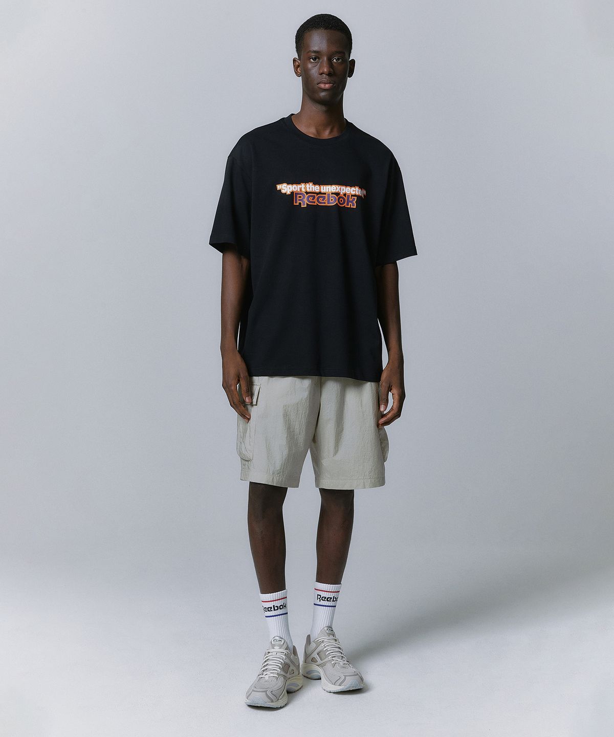 리복(REEBOK) TEAM SPORTS 그래픽 티셔츠 - 블랙