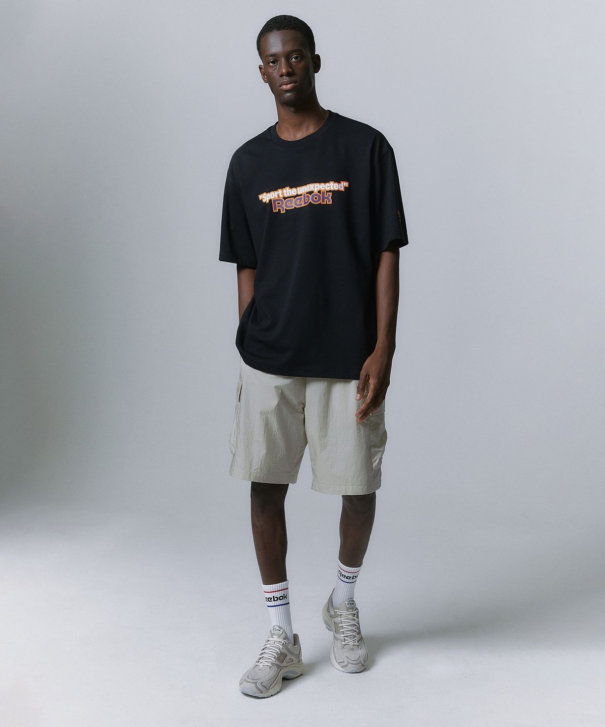 리복(REEBOK) TEAM SPORTS 그래픽 티셔츠 - 블랙