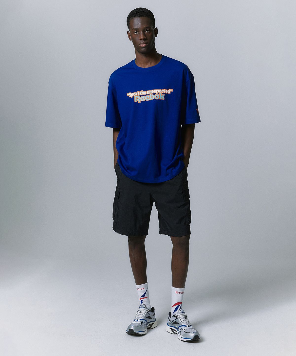 리복(REEBOK) TEAM SPORTS 그래픽 티셔츠 - 블루