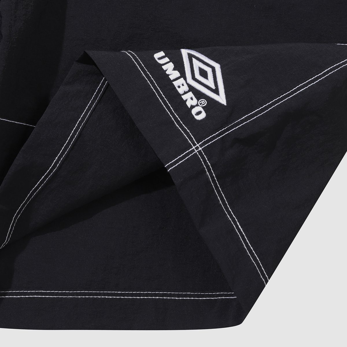 엄브로(UMBRO) 크리스피 타슬란 4.5부 반바지 블랙(UQ223CHP59)