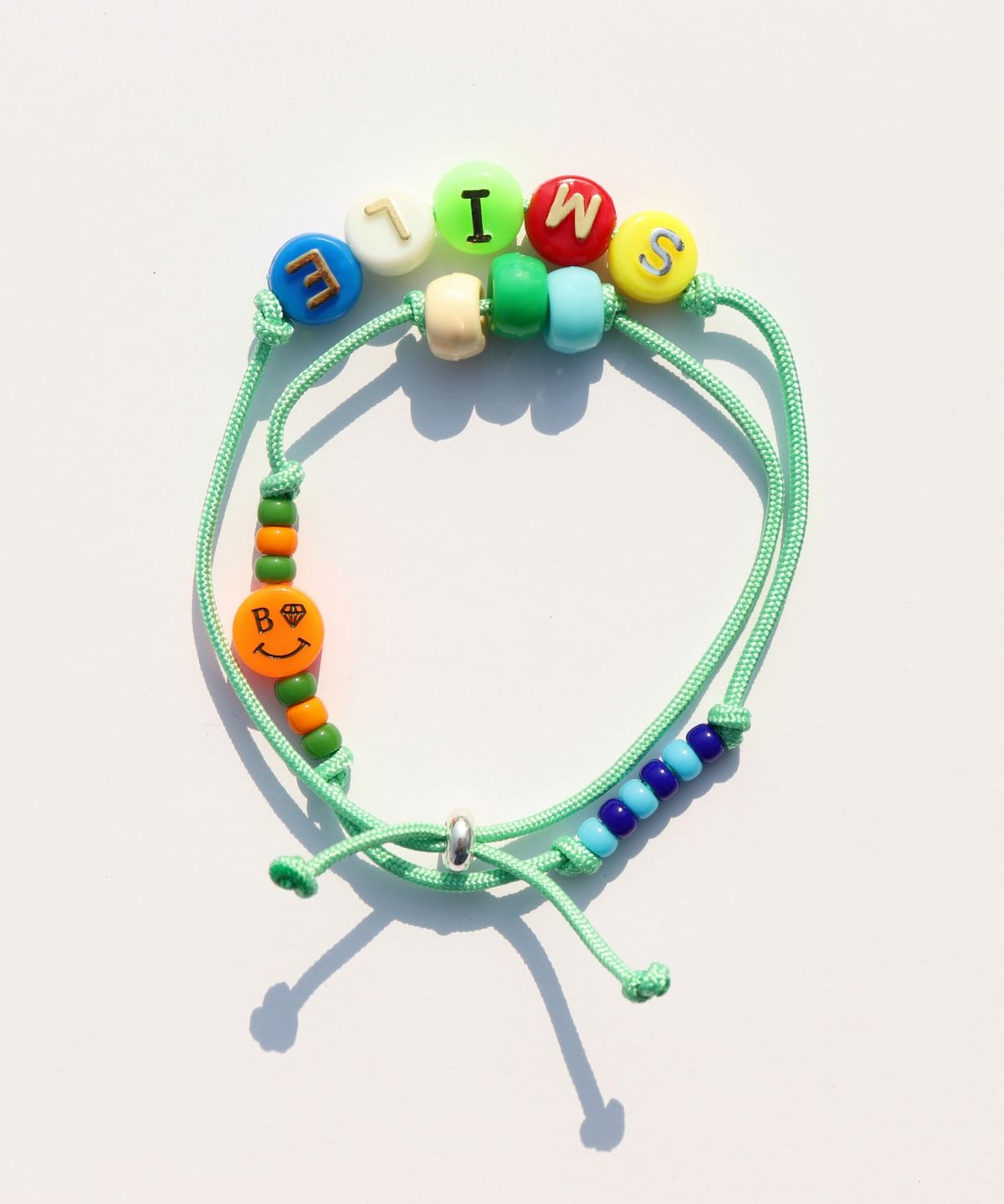 봉보(BONBEAU) Happy pop initial smile knot Bracelet 스마일 참 이니셜 비즈 두줄 매듭팔찌