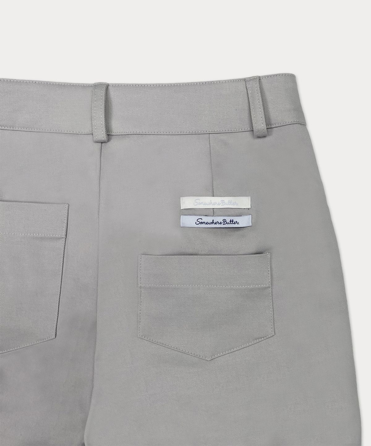 썸웨어버터(SOMEWHEREBUTTER) Slit Biker Pants - Light Grey