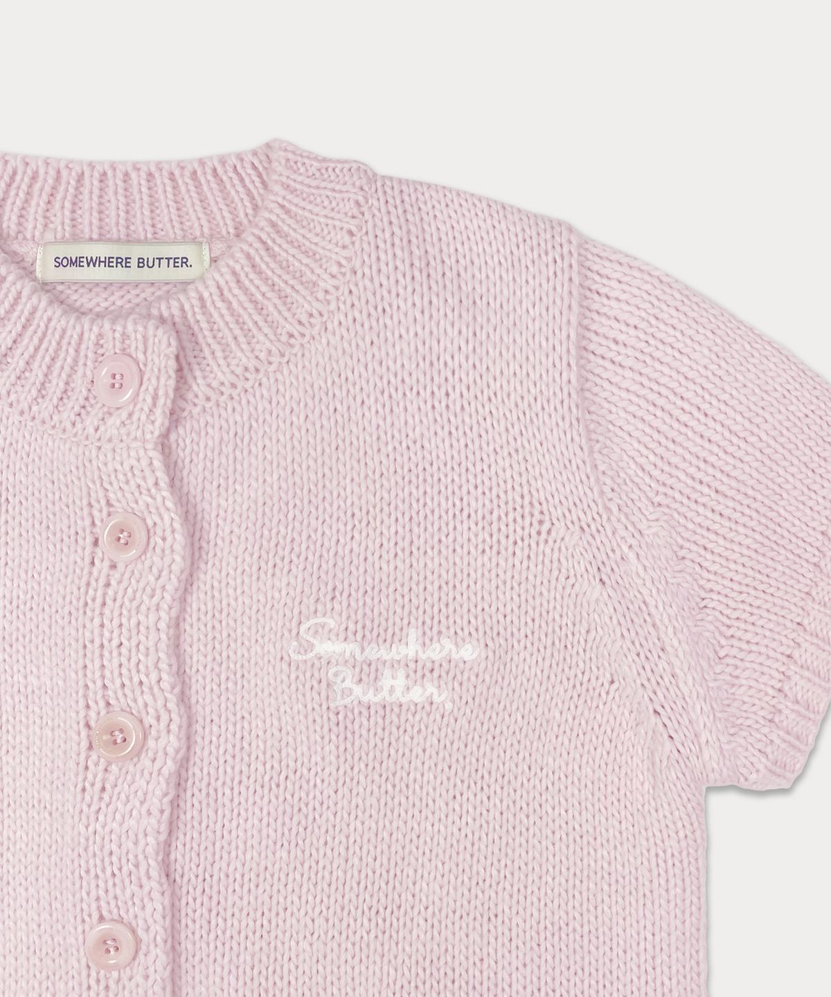 썸웨어버터(SOMEWHEREBUTTER) Letter Half Cardigan - Pink