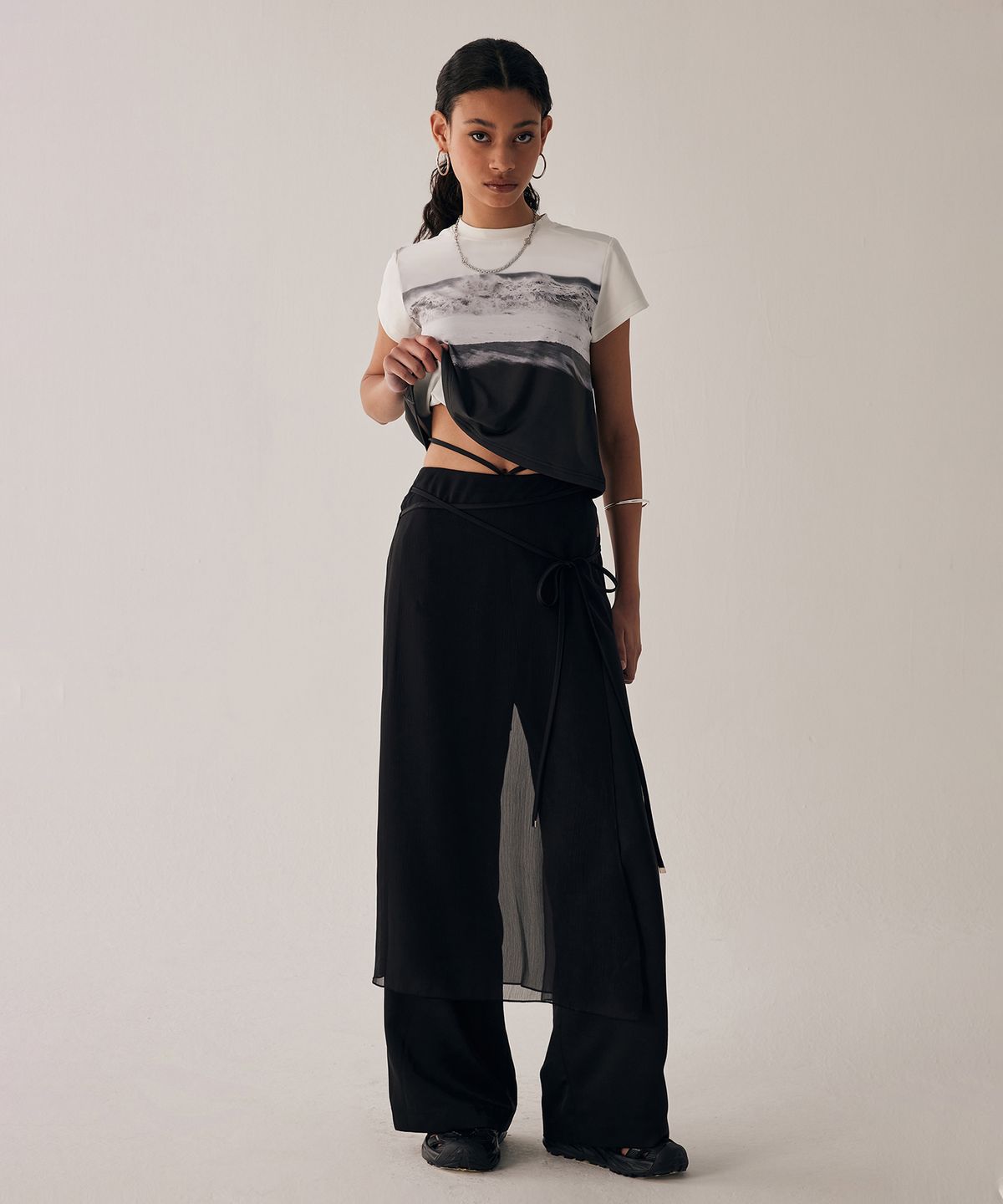 트리밍버드(TREEMINGBIRD) See-Through Strap Wrap Pants [ Black ]