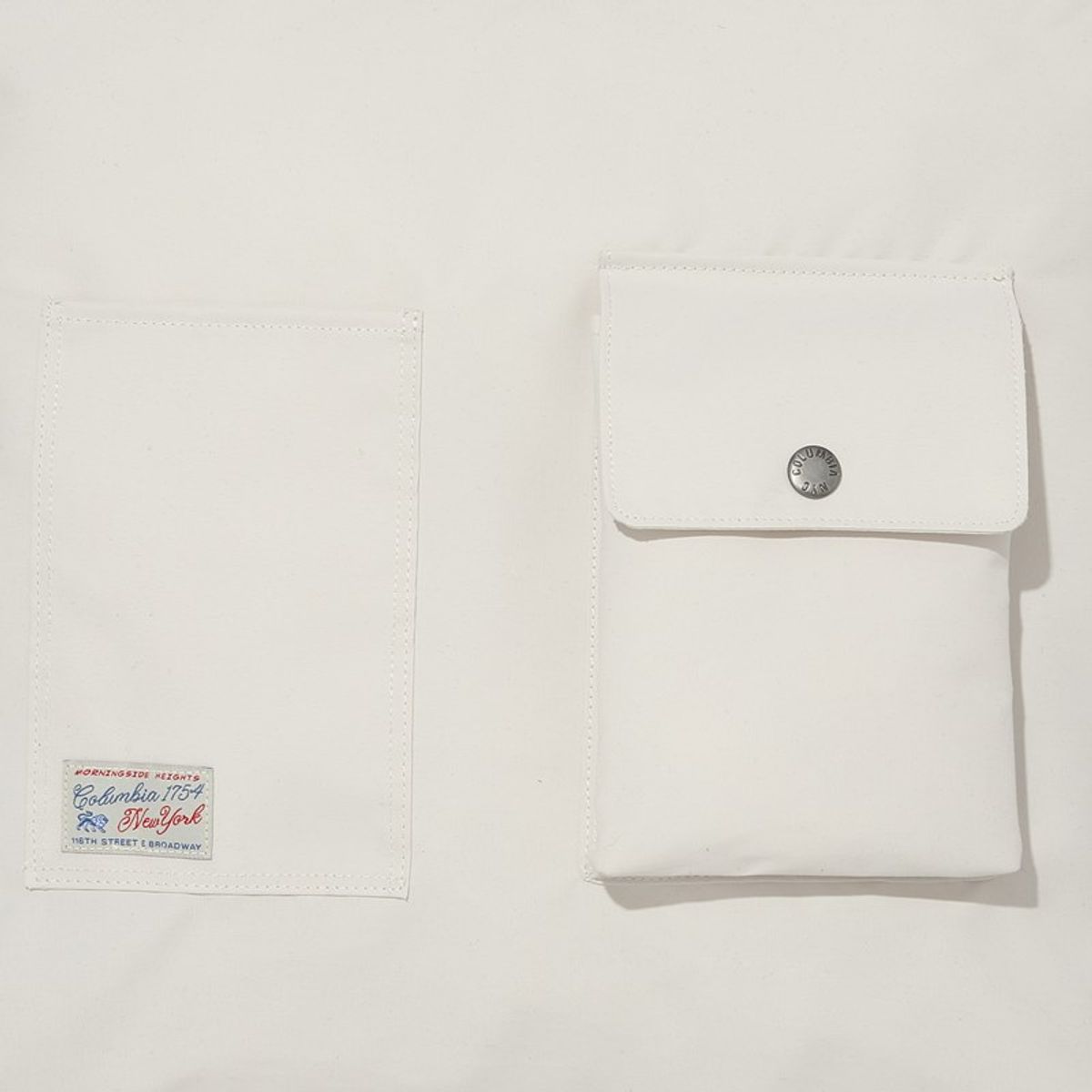 컬럼비아 유니버시티(COLUMBIA UNIVERSITY) SL-LABEL FRONT POCKET CROSS BAG 그레이지