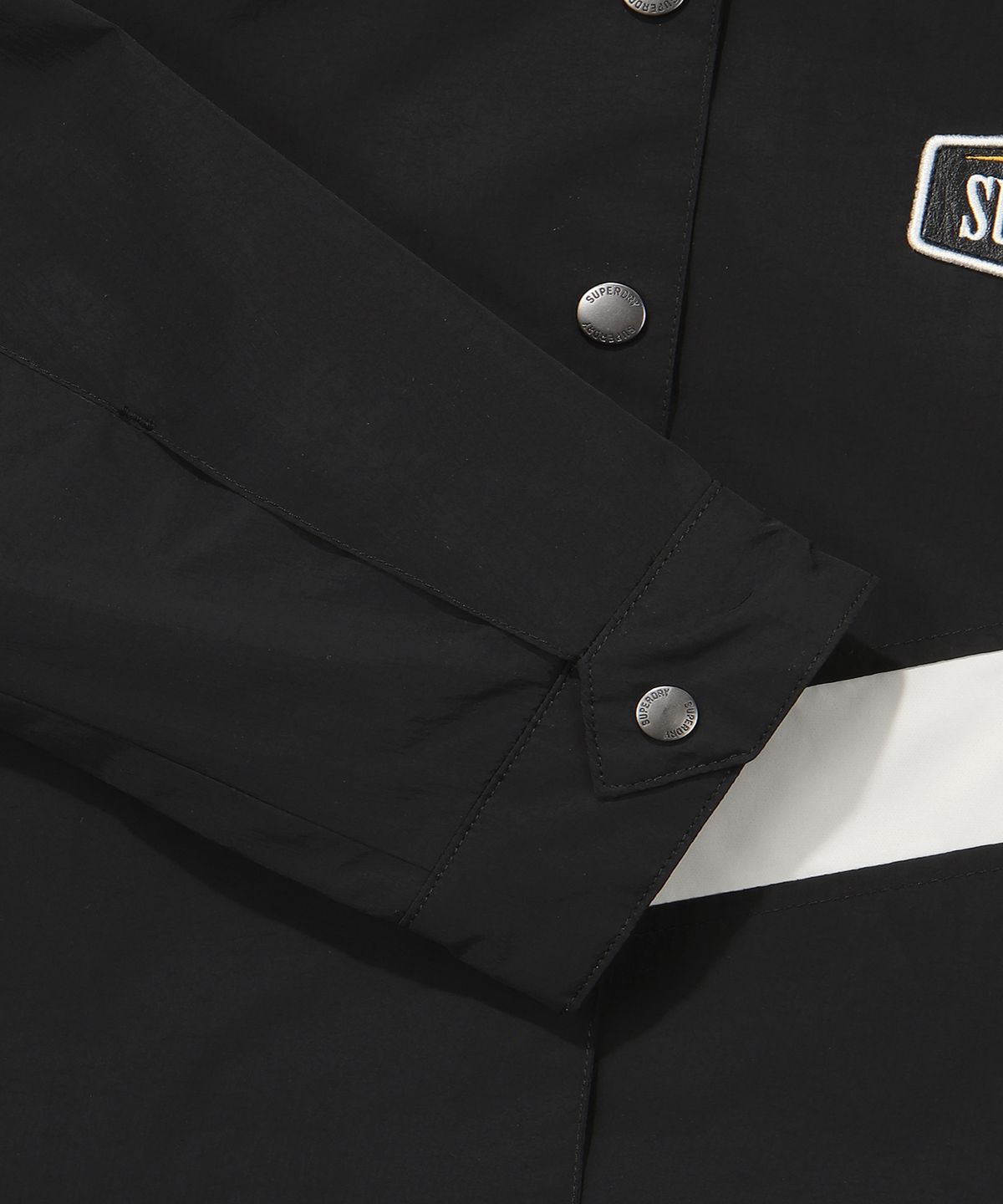 슈퍼드라이(SUPERDRY) W 나일론 레이싱 크롭 자켓 블랙