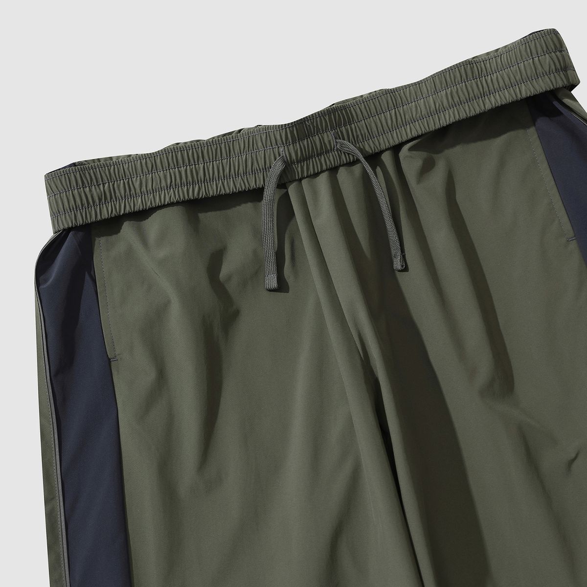 엄브로(UMBRO) 퓨쳐리즘 우븐 와이드 & 조거 2WAY 팬츠 카키(UP321CPT92)