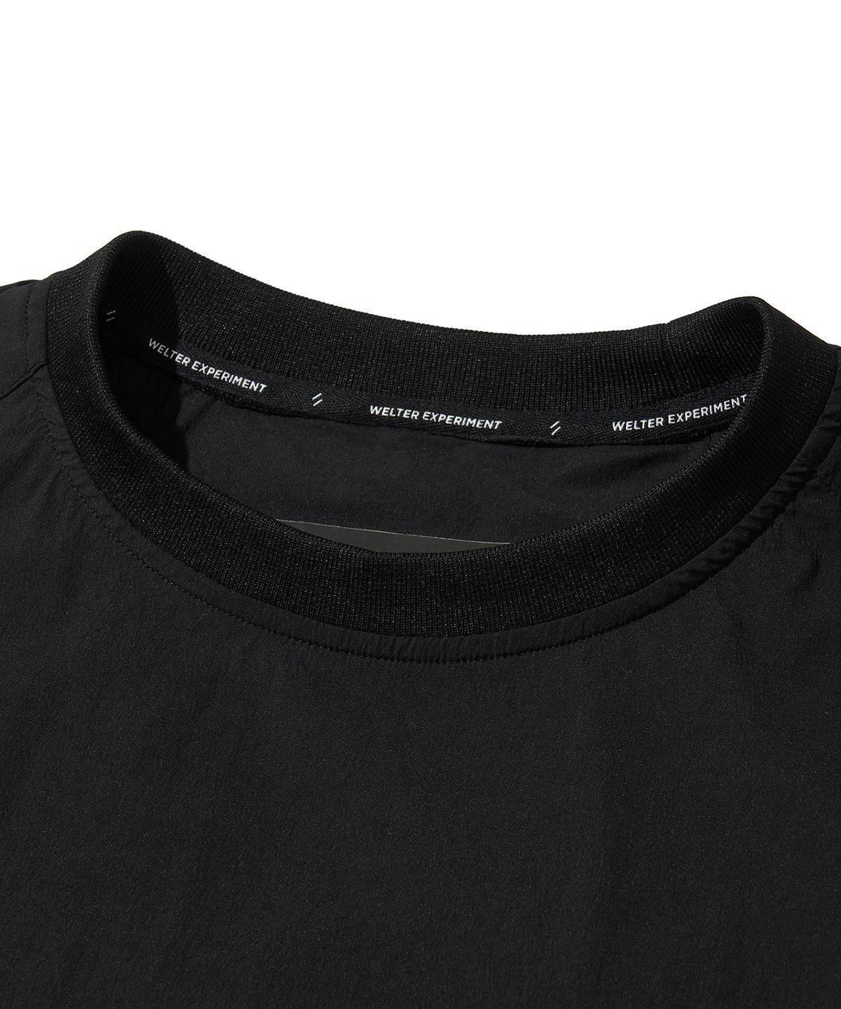 웰터 익스페리먼트(WELTER EXPERIMENT) ATTABAD STRETCH WINDBREAK PULLOVER_BLACK_WLT030