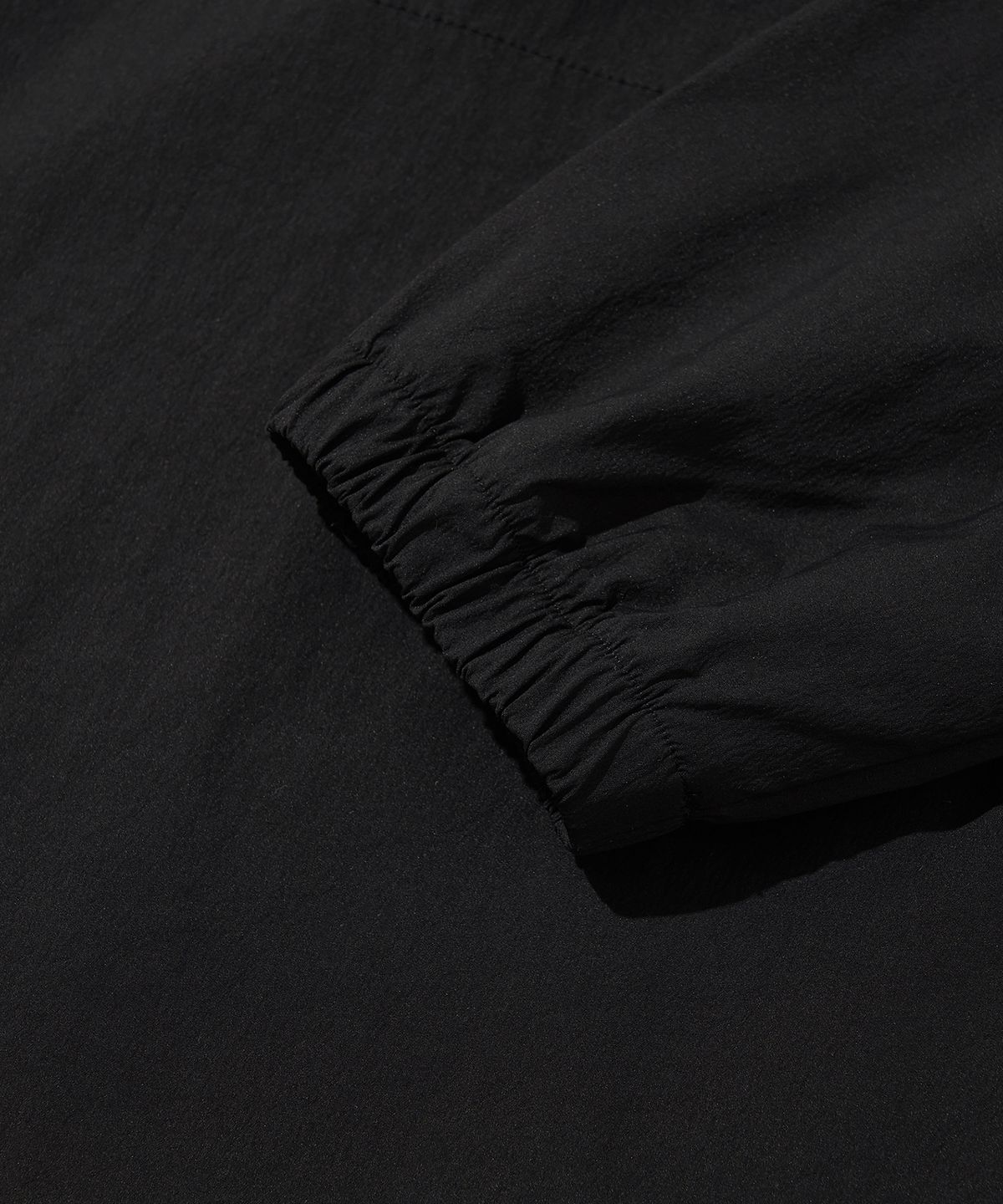 웰터 익스페리먼트(WELTER EXPERIMENT) ATTABAD STRETCH WINDBREAK PULLOVER_BLACK_WLT030