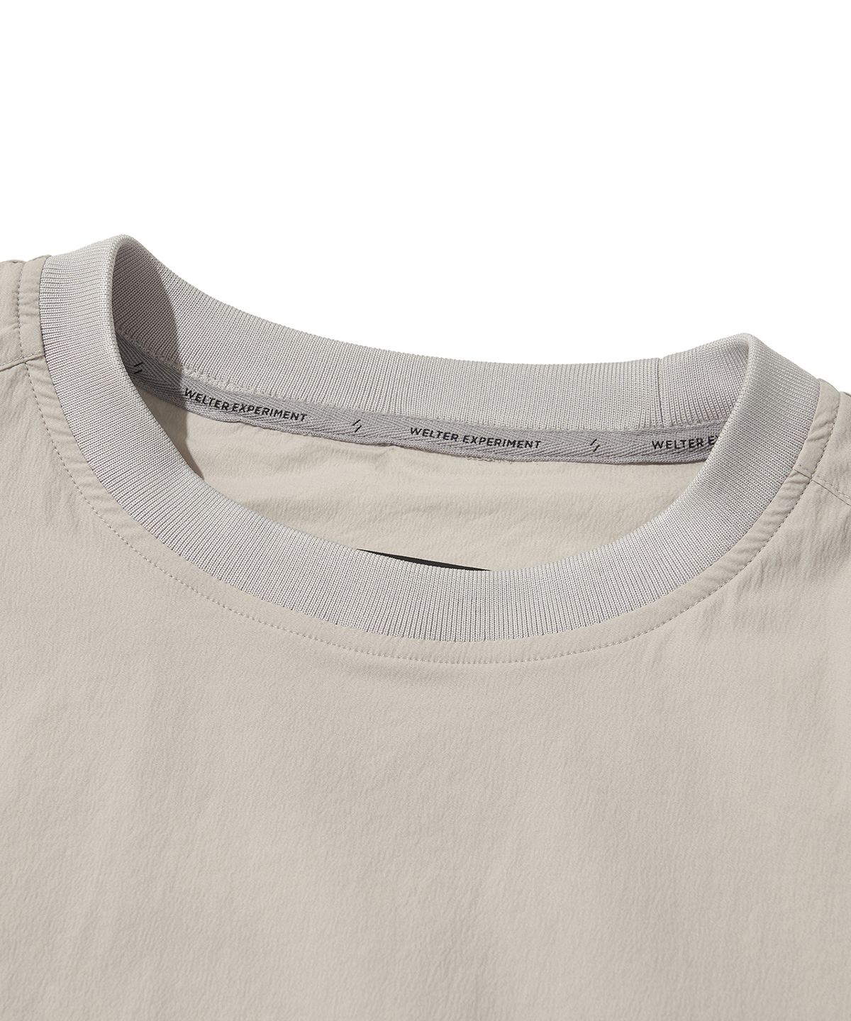 웰터 익스페리먼트(WELTER EXPERIMENT) ATTABAD STRETCH WINDBREAK PULLOVER_LIGHT GRAY_WLT031