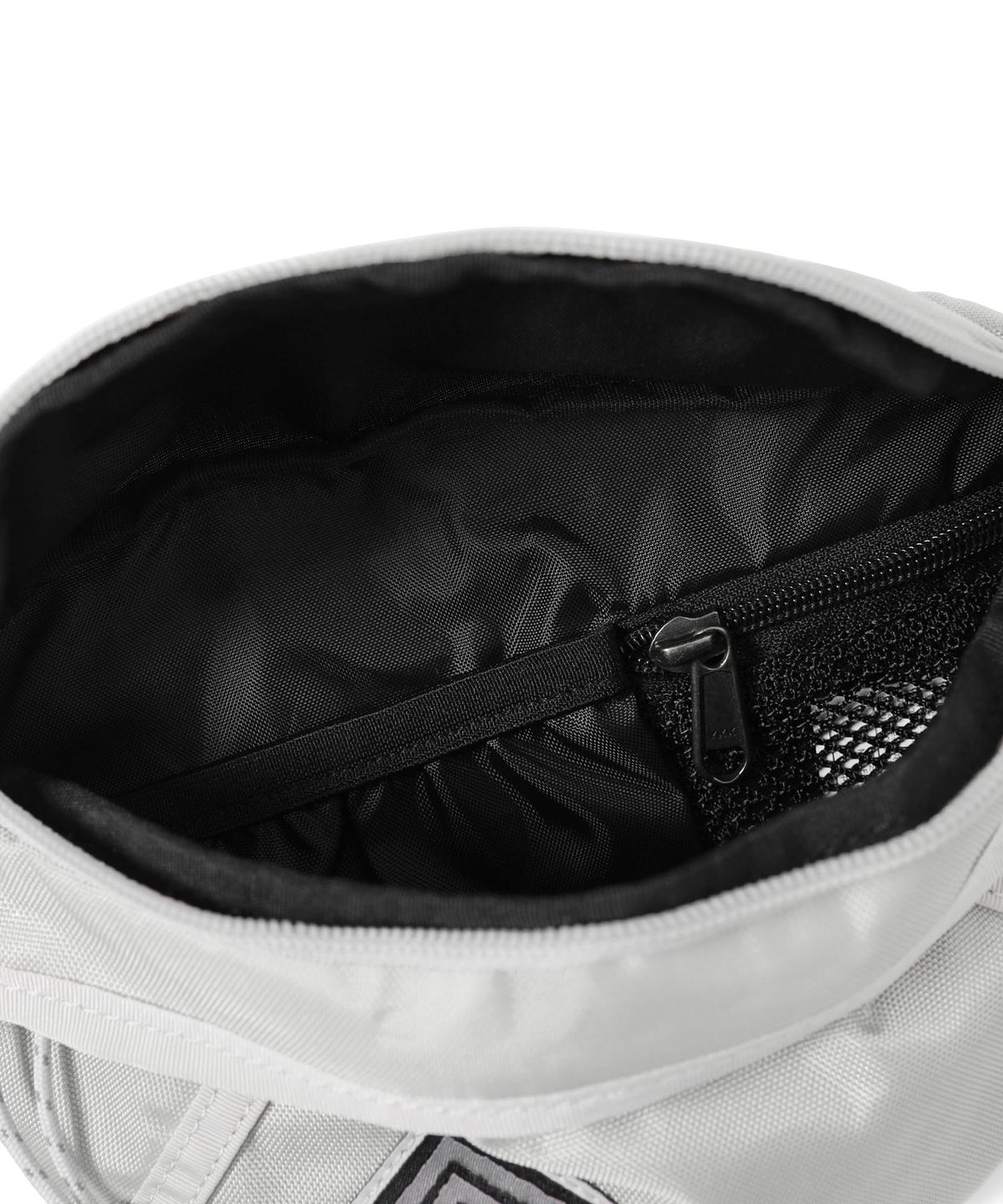 디스이즈네버댓(THISISNEVERTHAT) Washed Nylon Waist Bag Cream