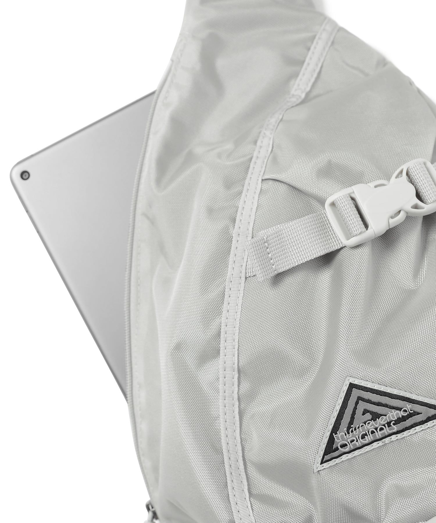 MUSINSA | thisisneverthat® Washed Nylon Sling Bag Cream