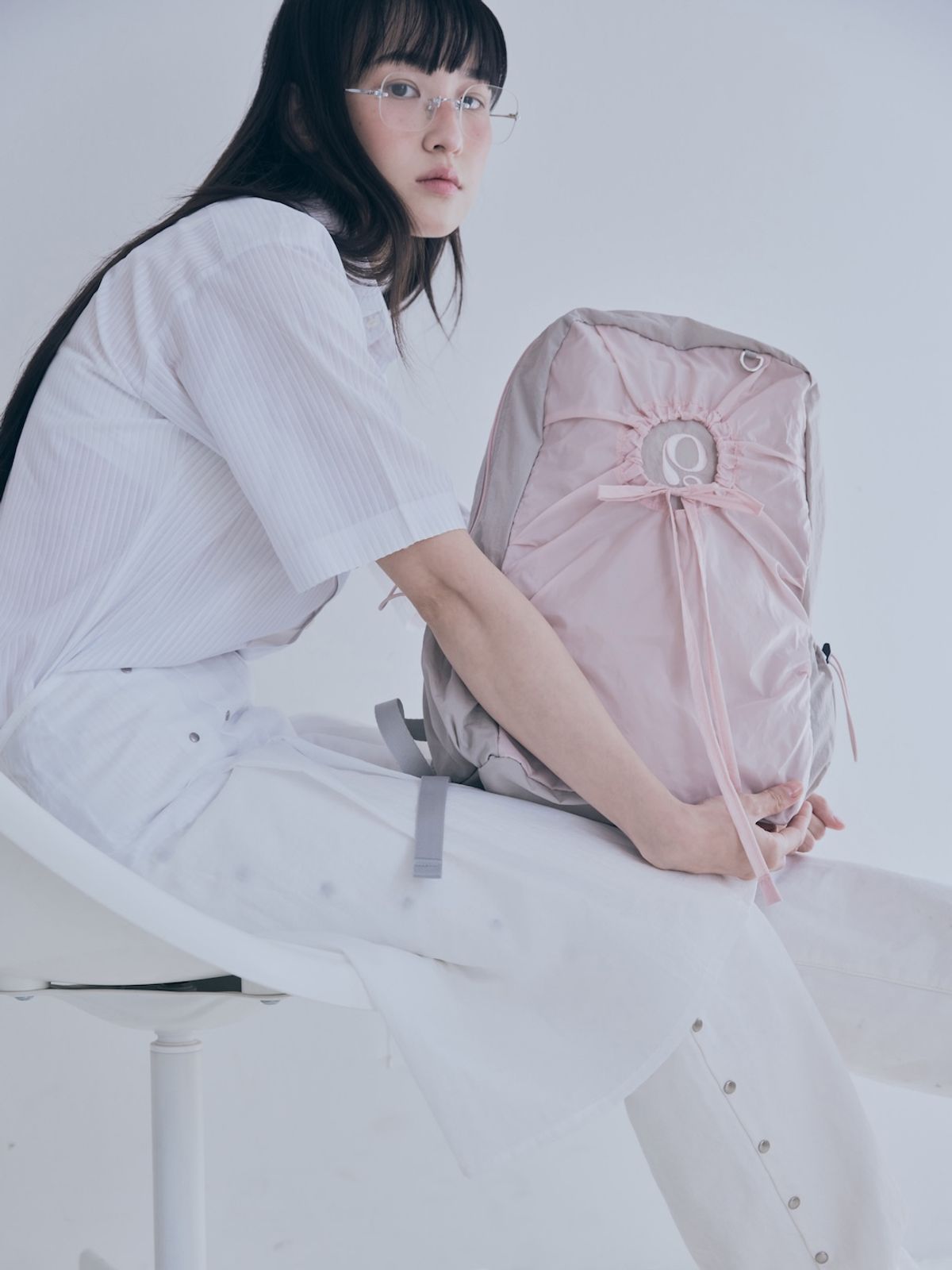 포이에(POIE) hole string PO backpack (pink gray)