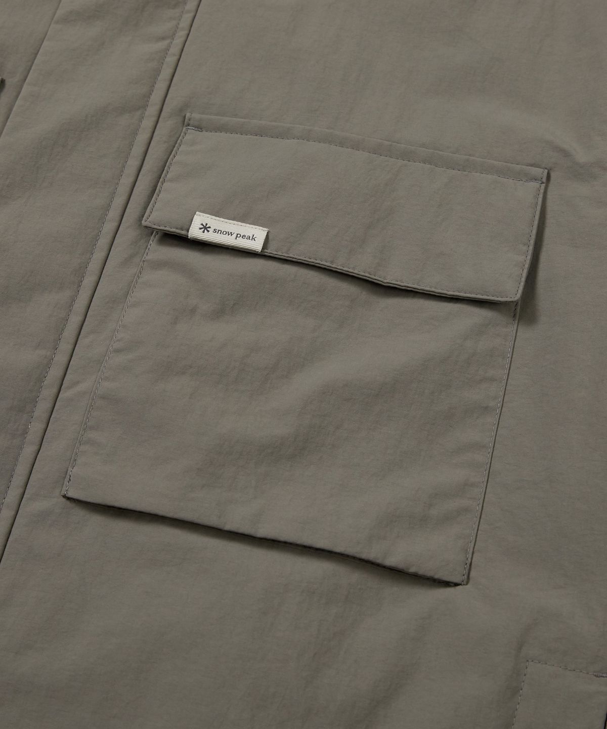 스노우피크 어패럴(SNOWPEAK APPAREL) 캠플 스탠드넥 바람막이 (S24FMCWB14) Dark Khaki