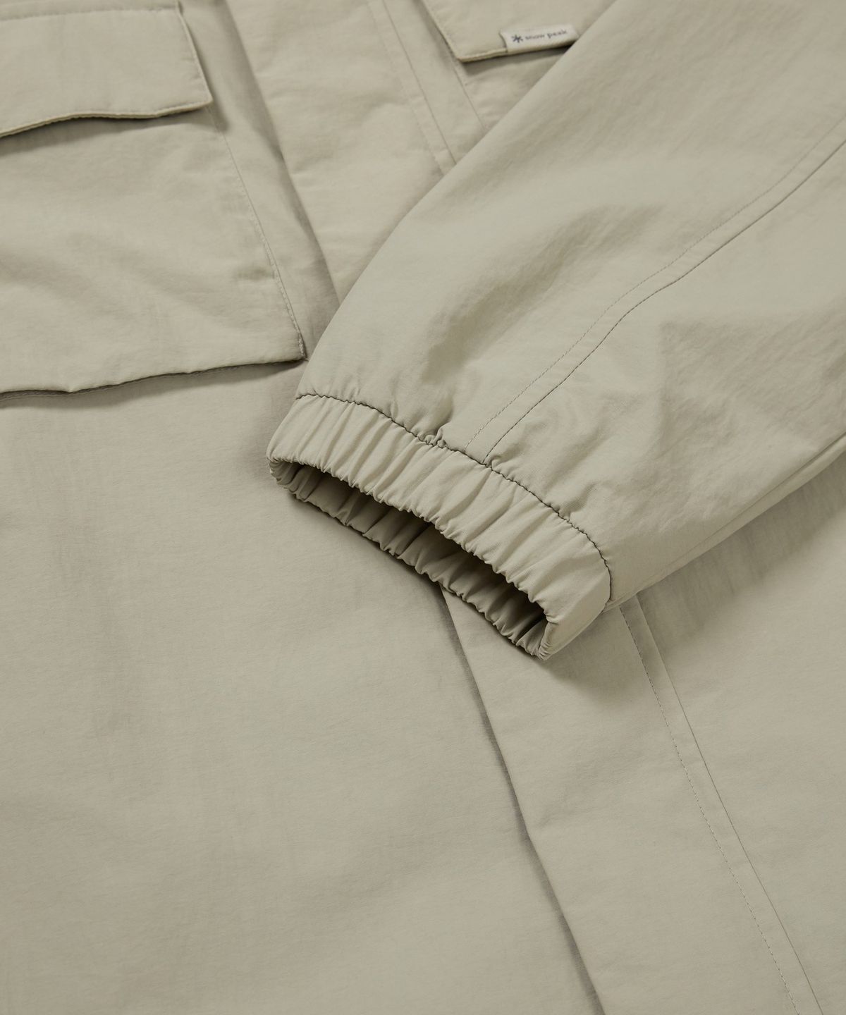 스노우피크 어패럴(SNOWPEAK APPAREL) 캠플 스탠드넥 바람막이 (S24FMCWB14) Beige Gray