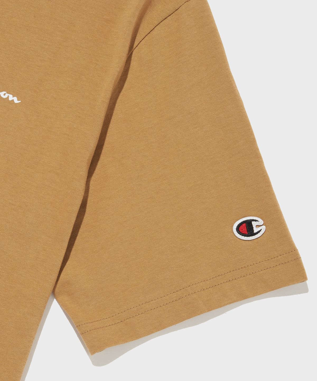 챔피온(CHAMPION) 스몰 스크립트 로고 코튼 반팔 티셔츠 Camel