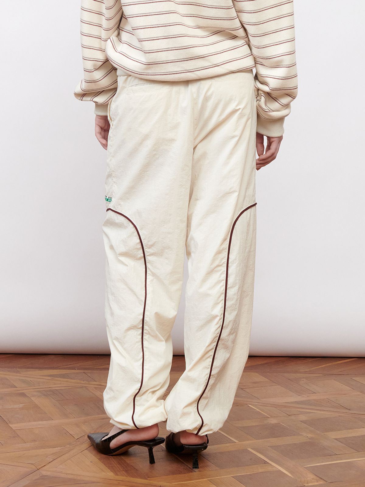 기준(KIJUN) Logo Woven Jogger Pants Ivory
