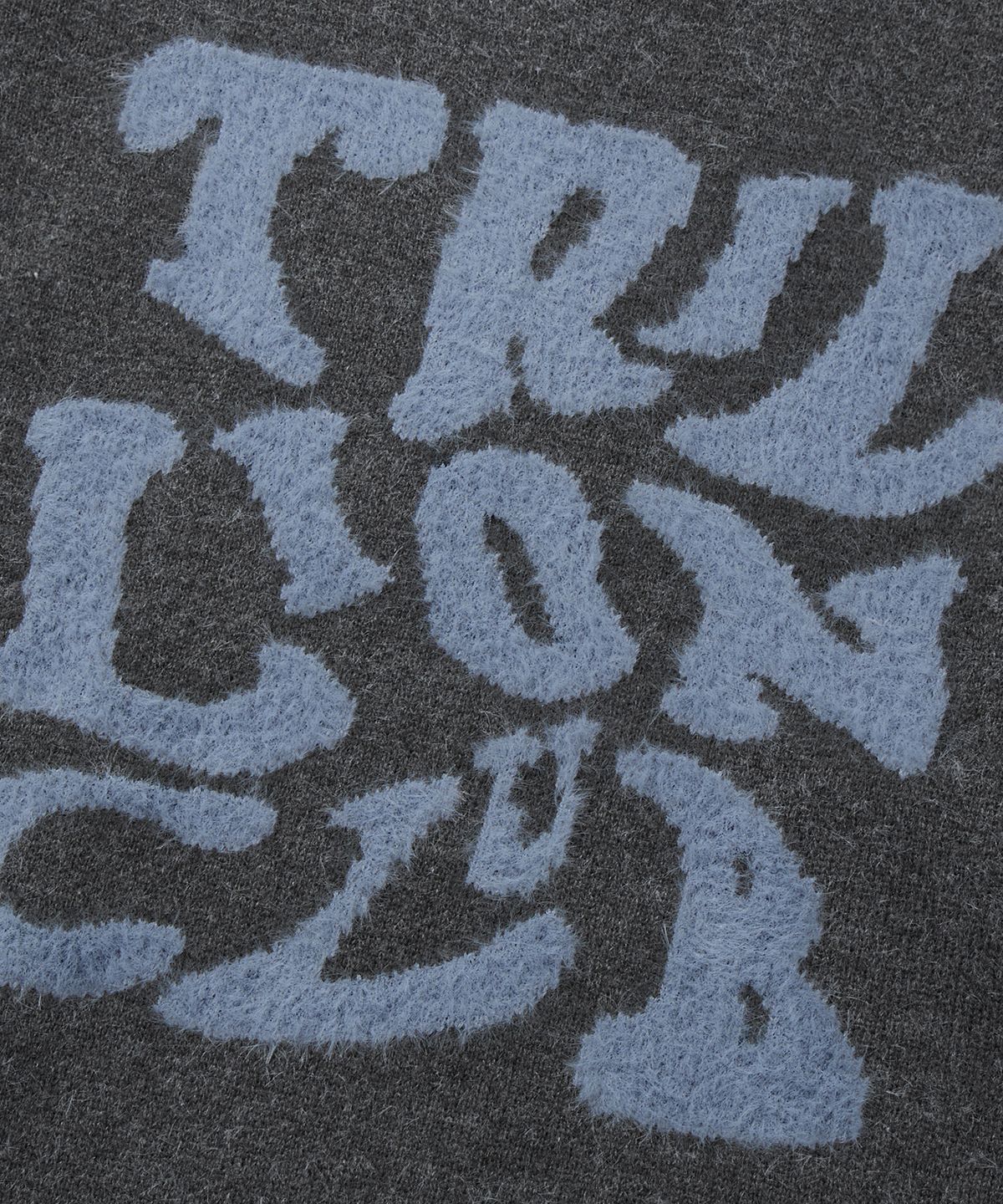 트릴리온(TRILLION) 헤어리 그래픽 로고 오버핏 자카드 니트 (CHARCOAL)