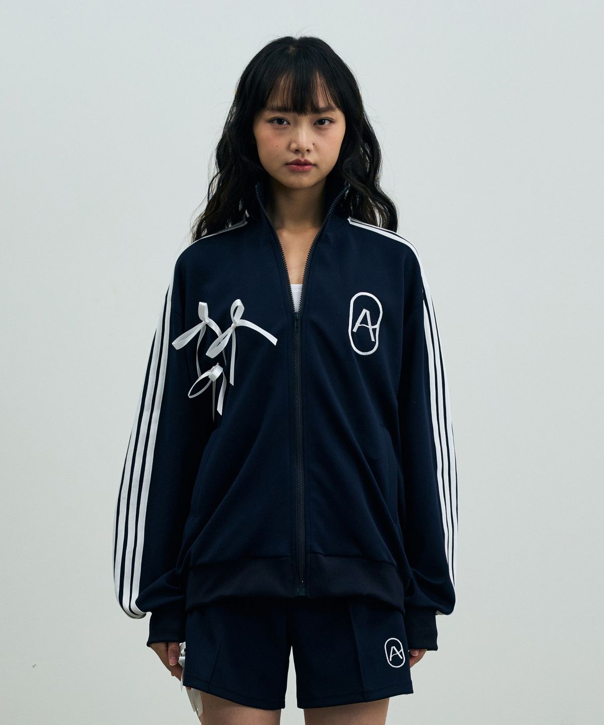 아리킴(ARIKIM) A RIBBON TRACK TOP / NAVY