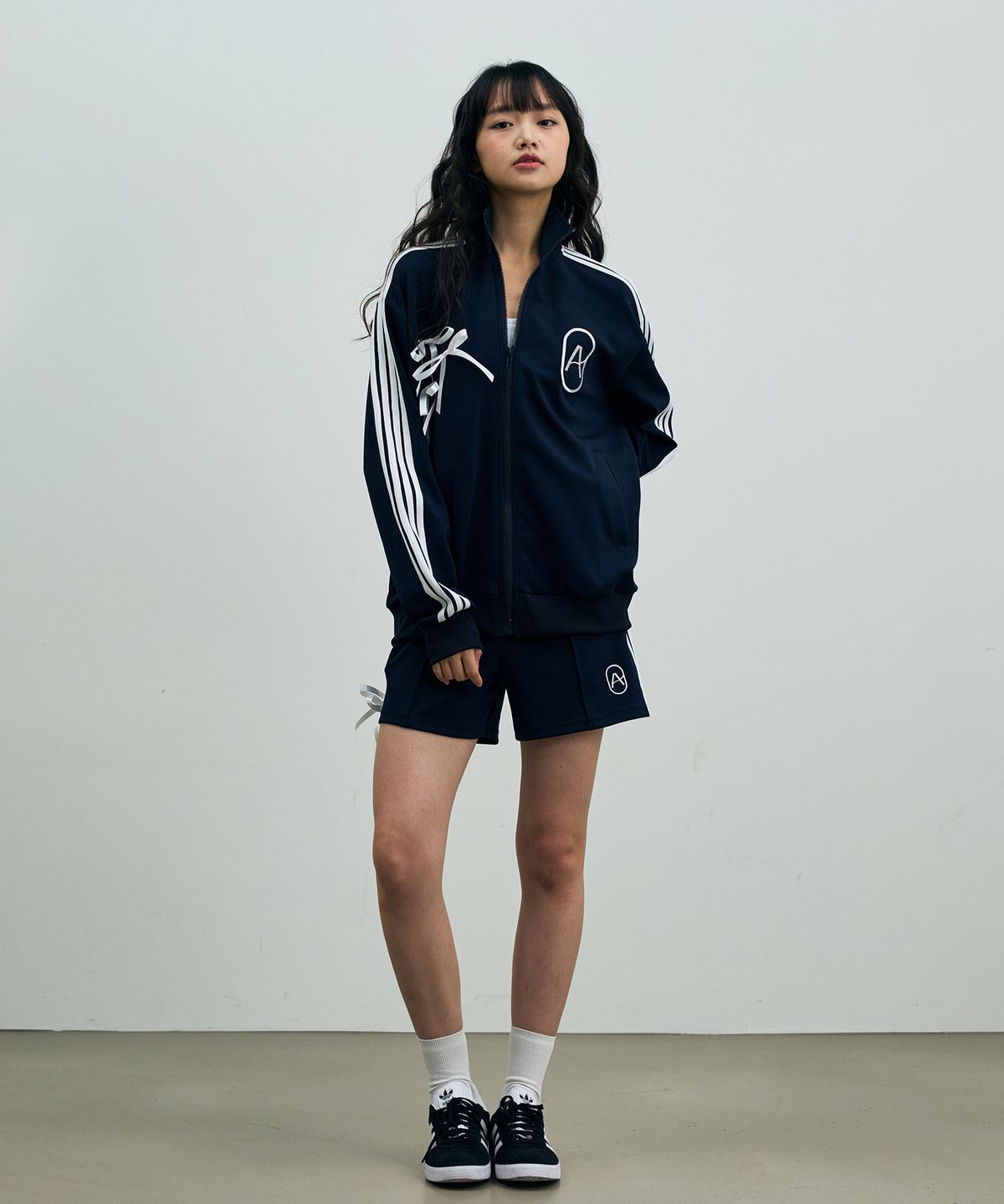 아리킴(ARIKIM) A RIBBON TRACK TOP / NAVY