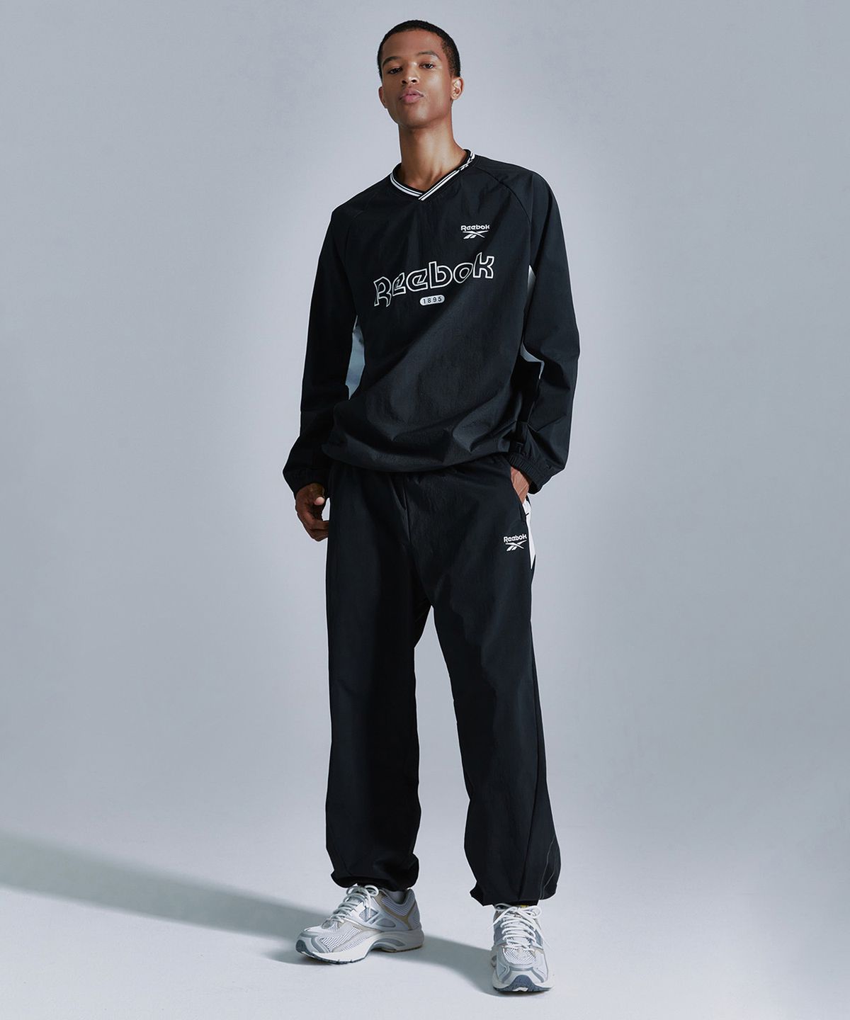 리복(REEBOK) 플로우 웜업 조거 팬츠 - 블랙