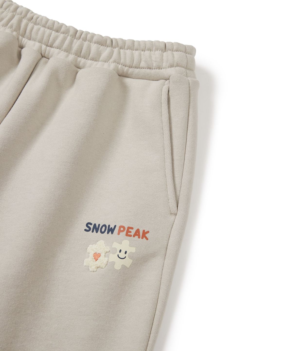 스노우피크 어패럴 키즈(SNOWPEAK APPAREL KIDS) 키즈 그래픽 조거 팬츠 (S24FKFFP80) Light Beige