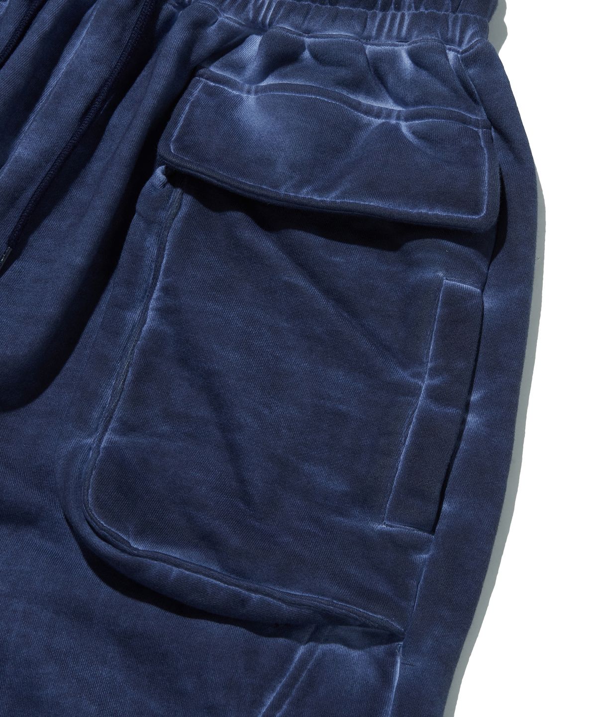 스웨이드(SUADE) CUT OUT SWEAT PANTS [NAVY]