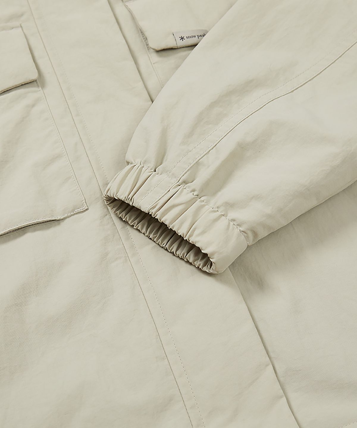 스노우피크 어패럴(SNOWPEAK APPAREL) 캠플 여성 바람막이 (S24FWCWB13) Light Beige