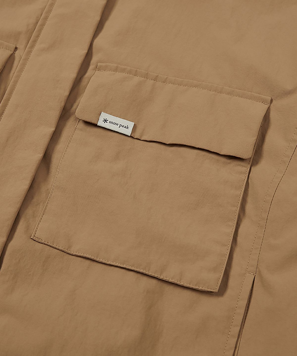 스노우피크 어패럴(SNOWPEAK APPAREL) 캠플 여성 바람막이 (S24FWCWB13) Camel