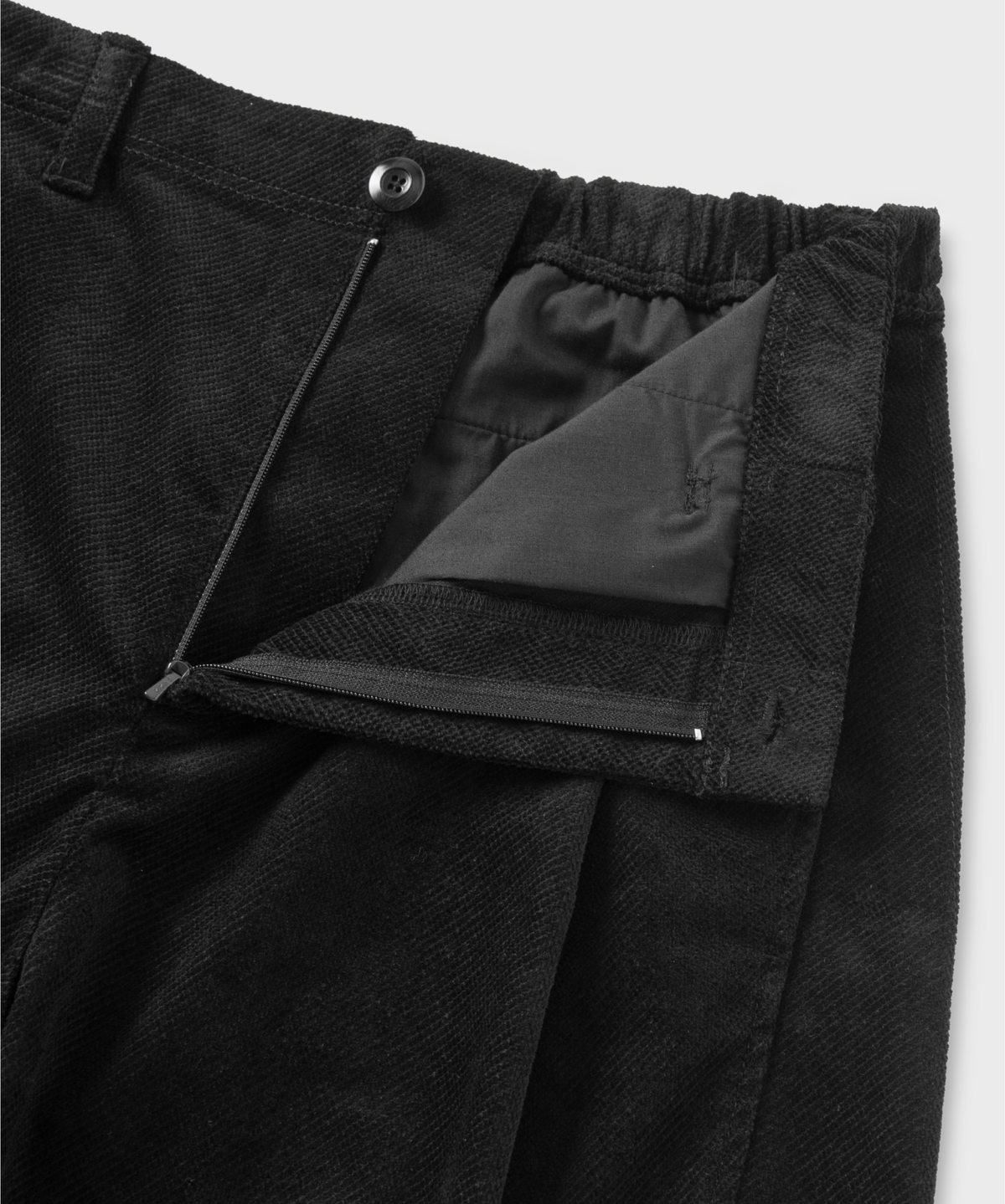 넌블랭크(NONBLANK) 원턱 커브드 스티치 팬츠_BLACK