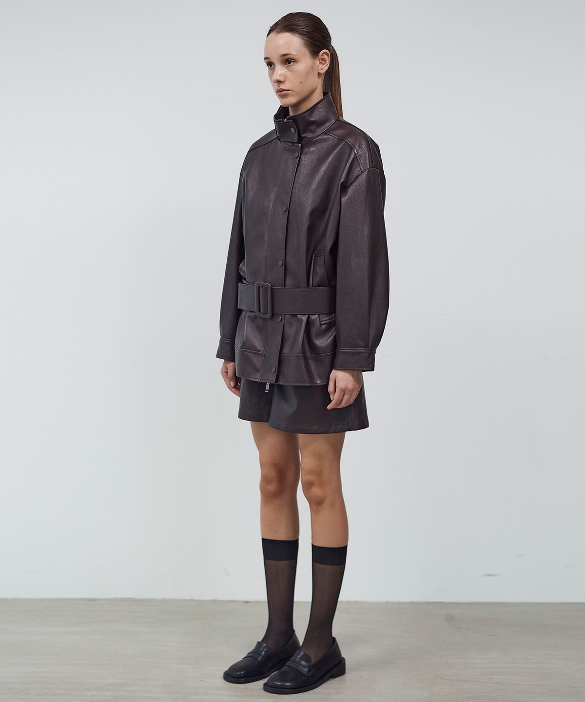 씨커슨(CKUSUN) BELTED HIGH NECK LEATHER JUMPER - BROWN