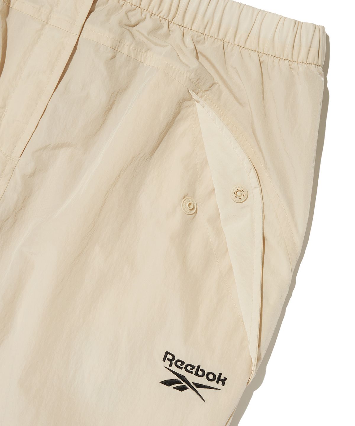 리복(REEBOK) 우븐 스트링 스커트 (W) - 베이지