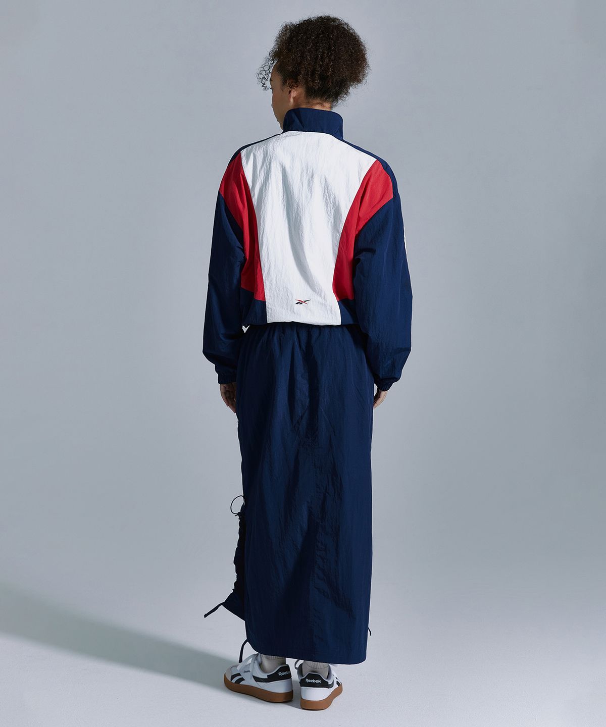 리복(REEBOK) 우븐 스트링 스커트 (W) - 네이비