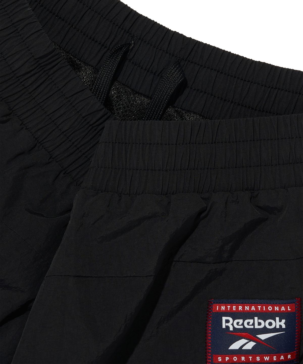 리복(REEBOK) 헤리티지 솔리드 2WAY 팬츠 - 블랙