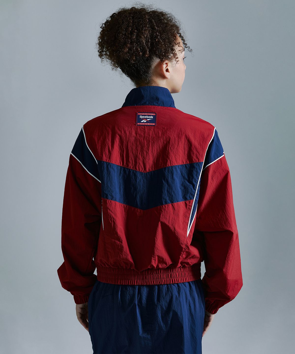 리복(REEBOK) 헤리티지 크롭 윈드 브레이커 (W) - 레드