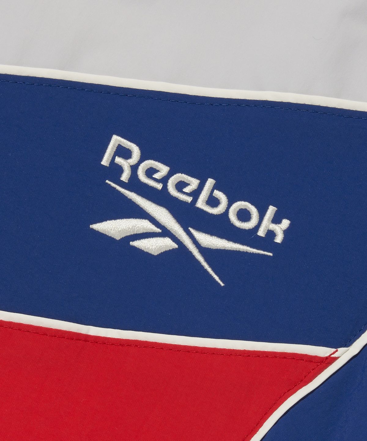 리복(REEBOK) 헤리티지 크롭 윈드 브레이커 (W) - 화이트