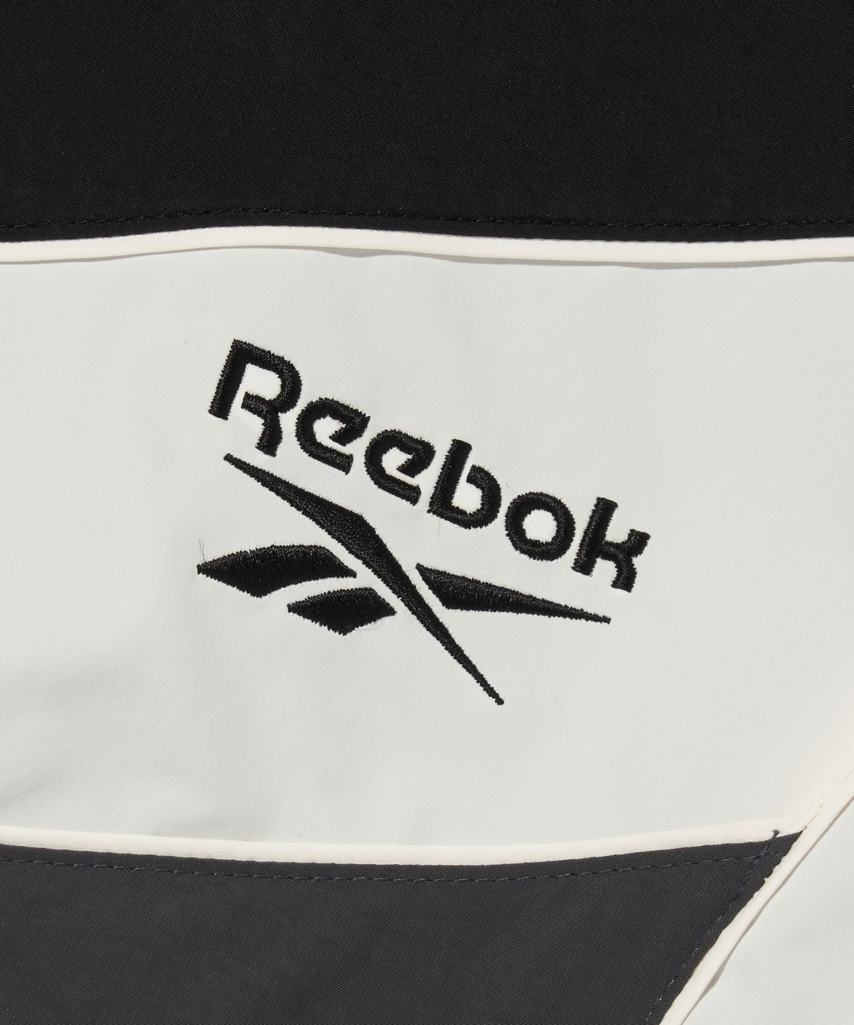 리복(REEBOK) 헤리티지 크롭 윈드 브레이커 (W) - 블랙