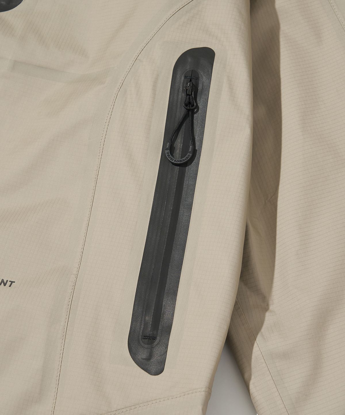 웰터 익스페리먼트(WELTER EXPERIMENT) 3LAYER SLIT REFLECTIVE HARD SHELL JACKET_CREAM_WOL064