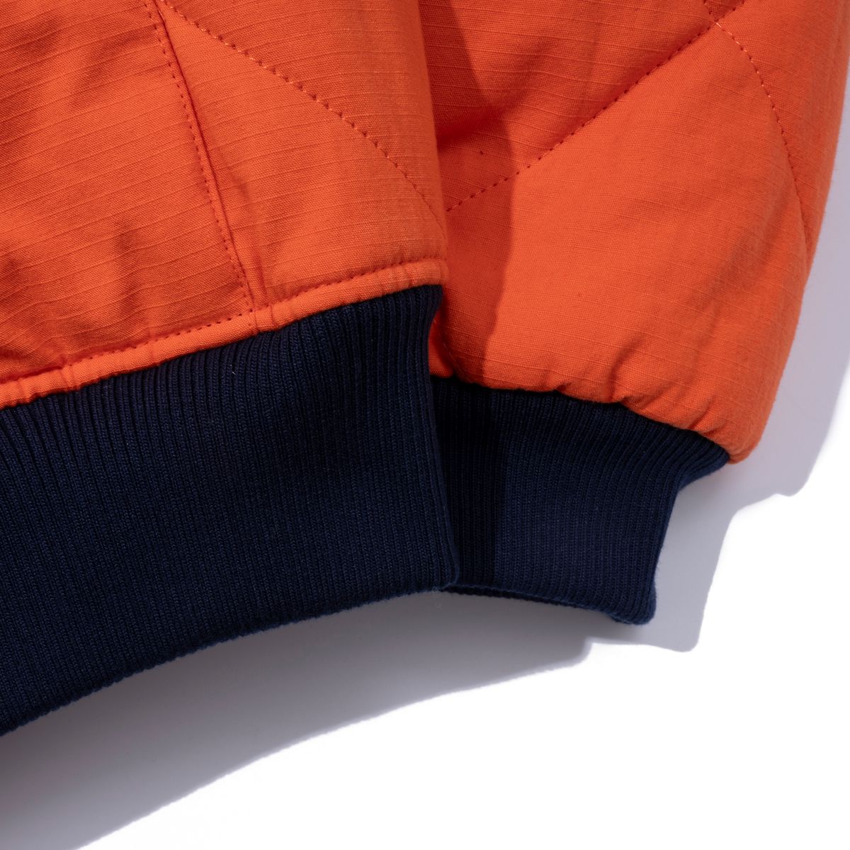 엑스트라오디너리(EXTRAORDINARY) MEDIEVAL LOGO QUILTING JUMPER  ORANGE