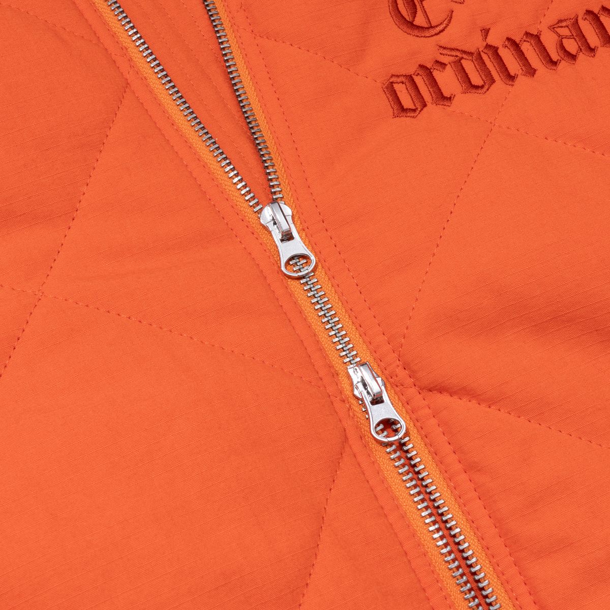 엑스트라오디너리(EXTRAORDINARY) MEDIEVAL LOGO QUILTING JUMPER  ORANGE