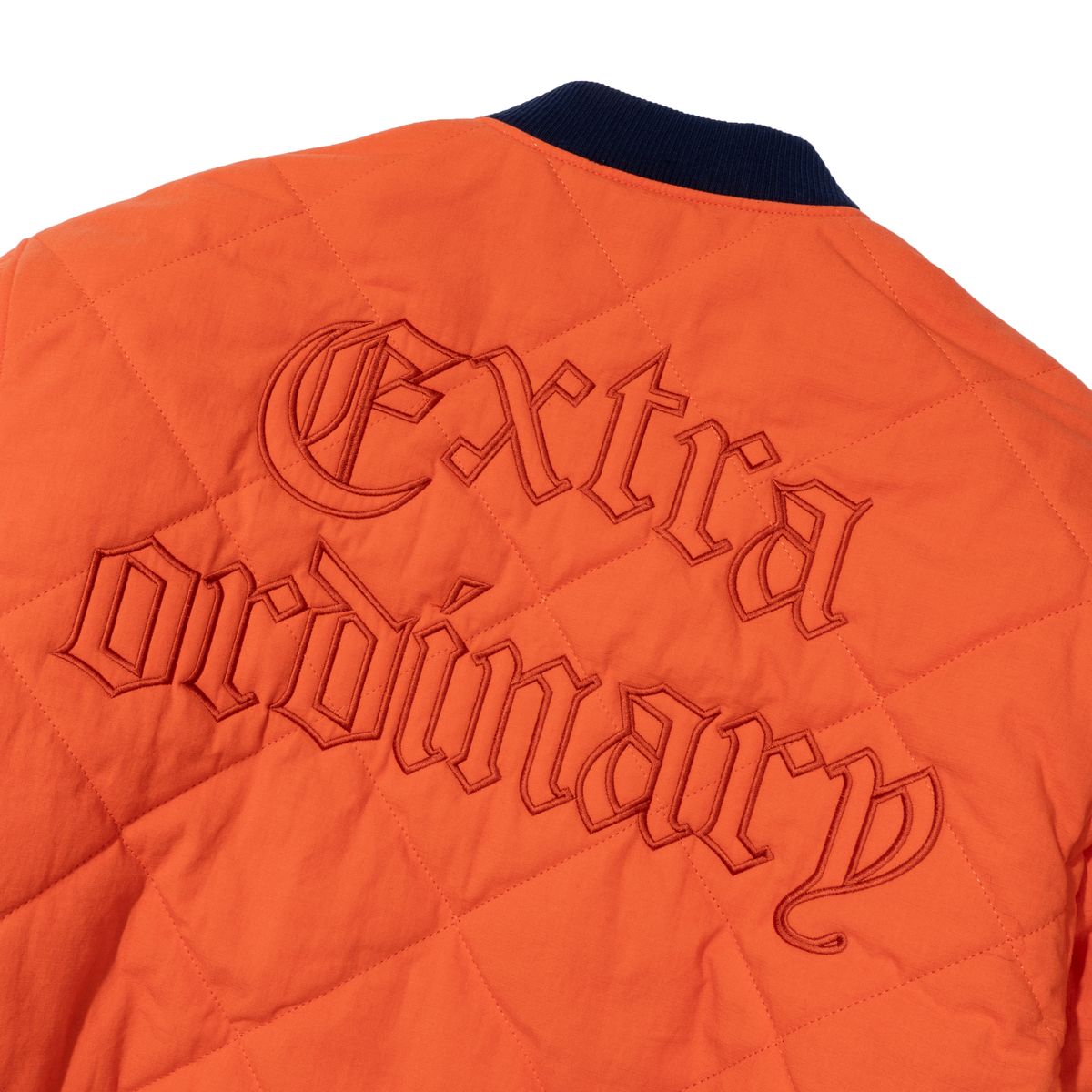 엑스트라오디너리(EXTRAORDINARY) MEDIEVAL LOGO QUILTING JUMPER  ORANGE