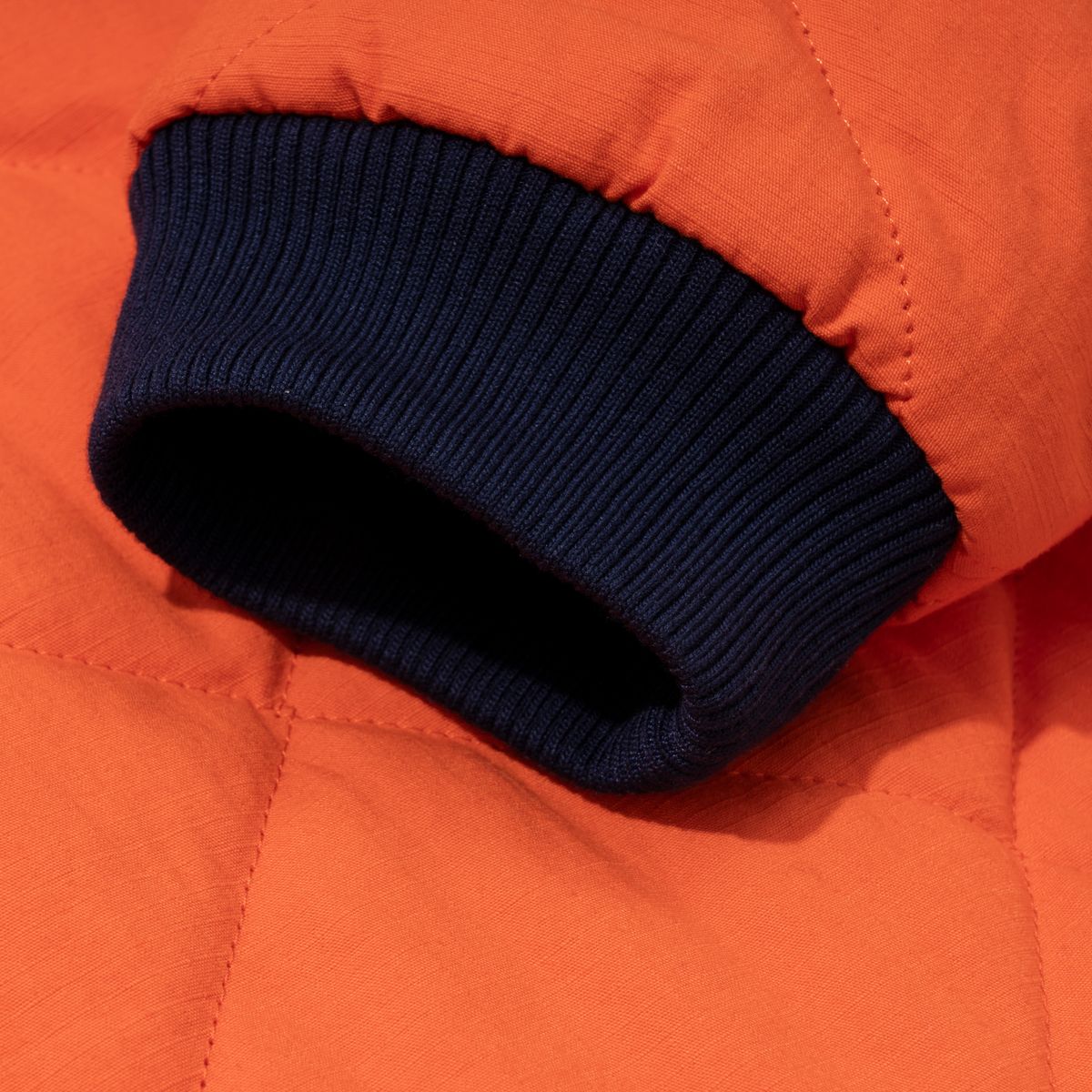 엑스트라오디너리(EXTRAORDINARY) MEDIEVAL LOGO QUILTING JUMPER  ORANGE