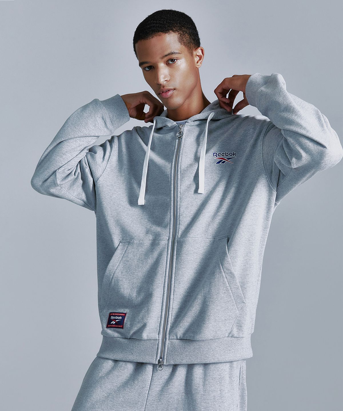 리복(REEBOK) 벡터 후드집업 - 그레이