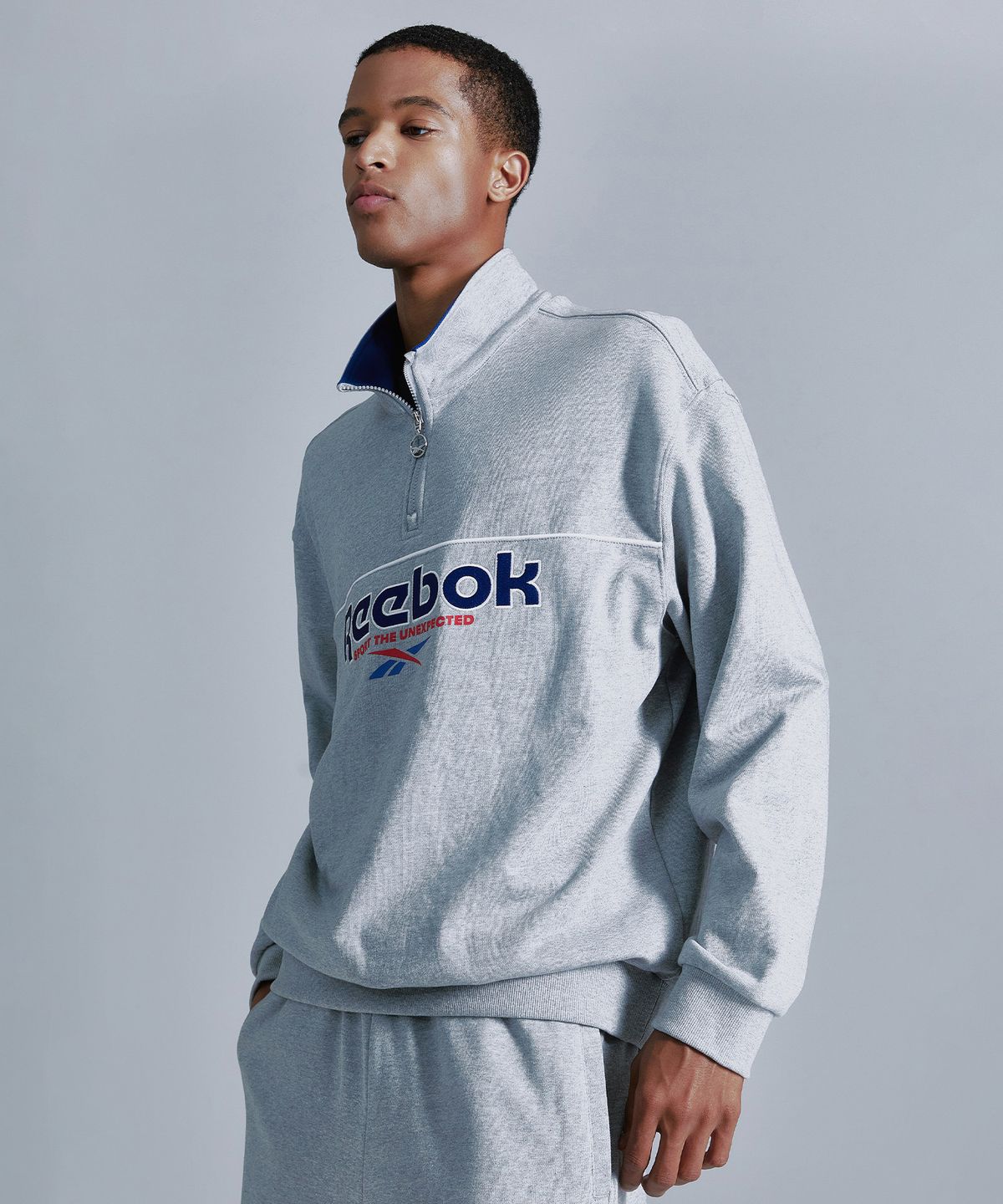 리복(REEBOK) 벡터 하프 집업 - 그레이