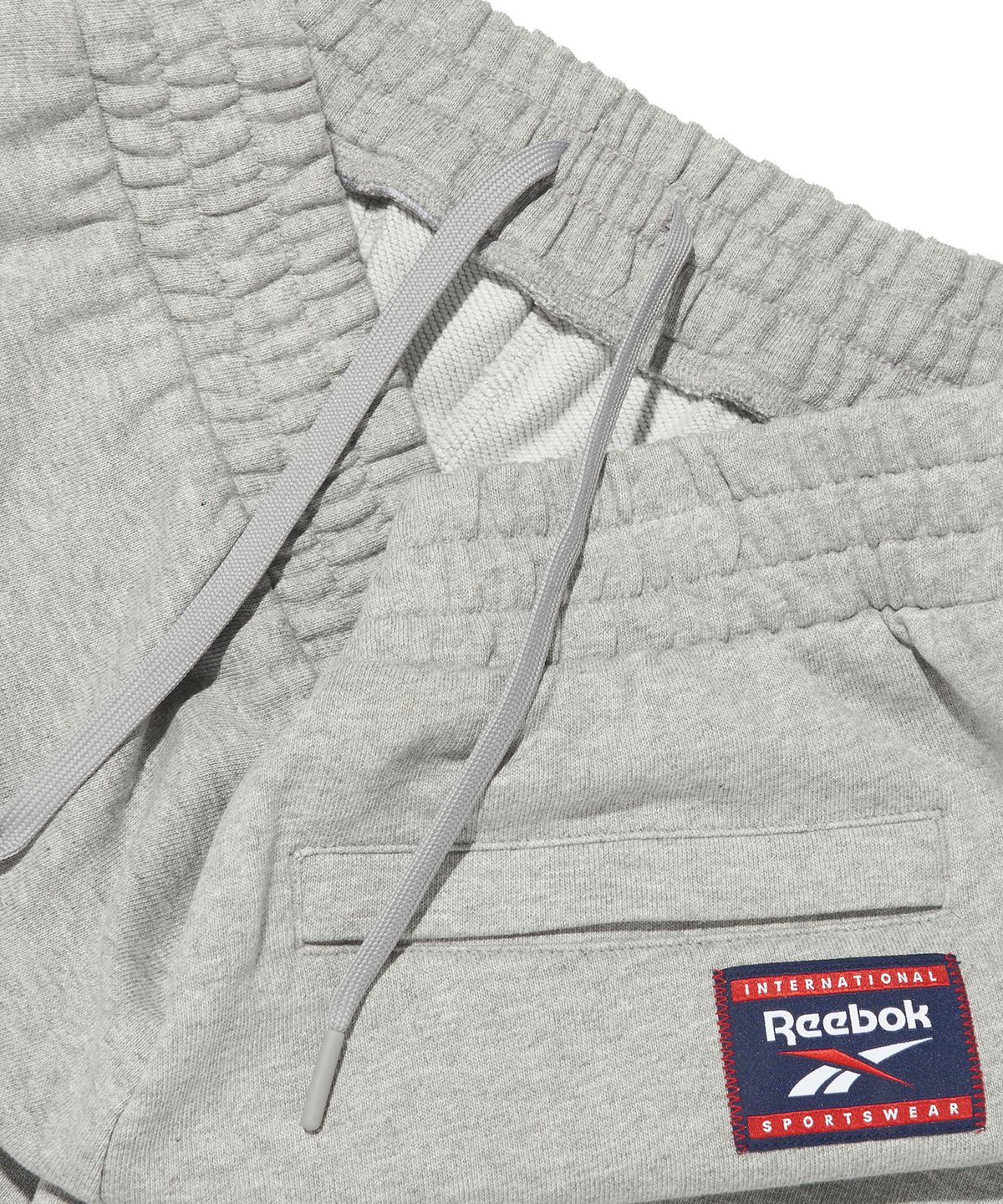리복(REEBOK) 루즈핏 스웨트 조거 팬츠 - 그레이