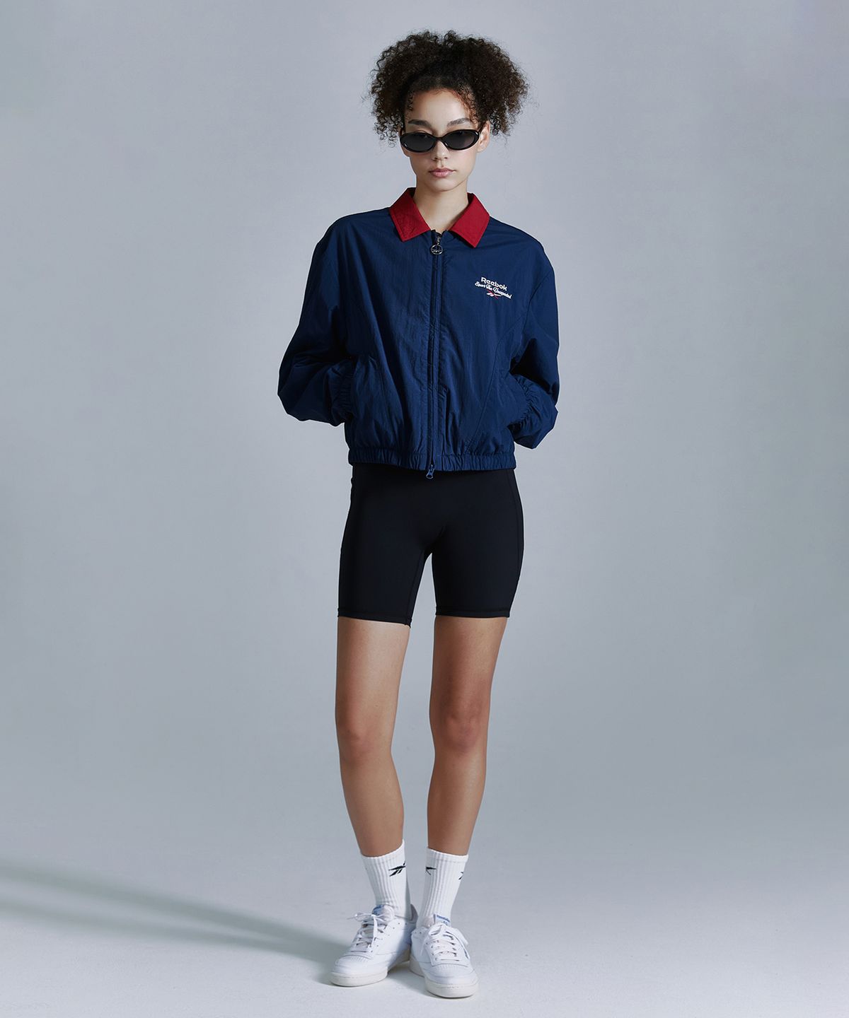 리복(REEBOK) 블루종 윈드 브레이커 (W) - 네이비