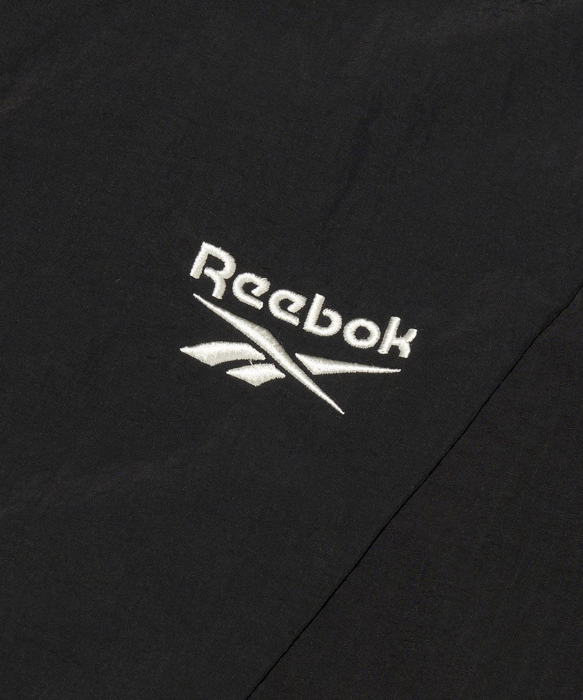 리복(REEBOK) 립스탑 트렌치 코트 (W) - 블랙