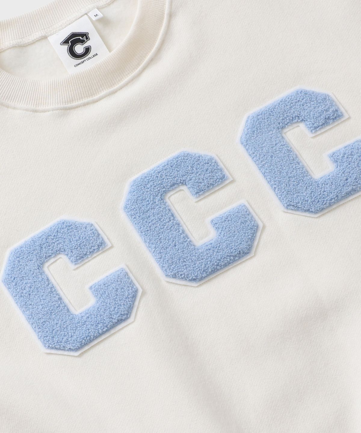 컨셉트컬리지(CONCEPTCOLLEGE) CCC 스카이블루 패치 스웨트셔츠_아이보리 [남녀공용]